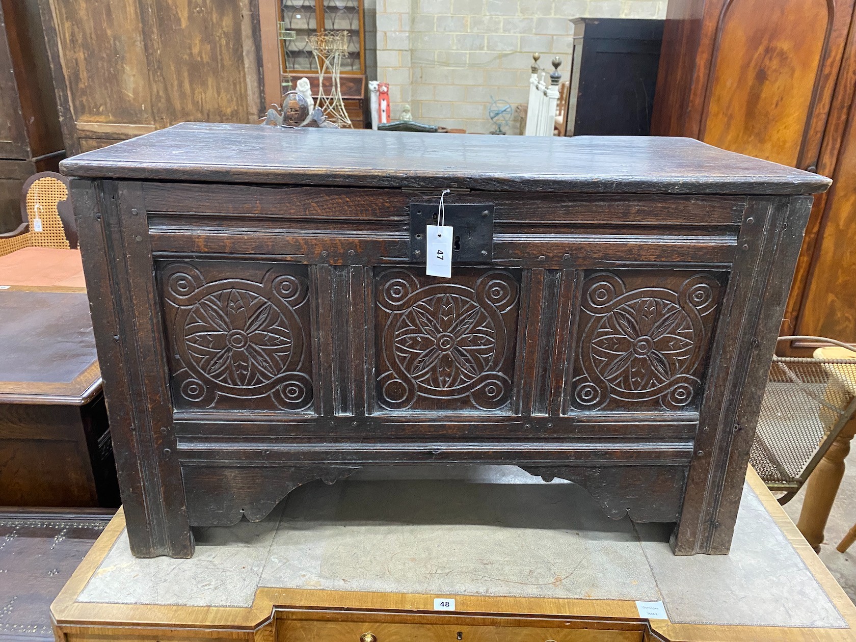 A late 17th / early 18th century panelled carved oak coffer, length 101cm, depth 49cm, height 64cm
